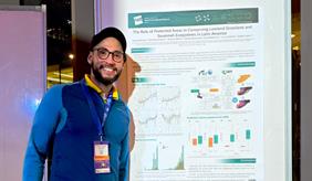 Sergio Bolívar-Santamaría with his poster titled “The role of protected areas in conserving lowland grassland and savannah ecosystems in Latin America”