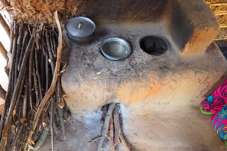 Improved cooking stoves in Tanzania made from local materials like mud, bricks, and pipes